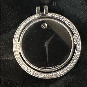 Beautiful Movado stainless and diamond pendent watch with quartz movement